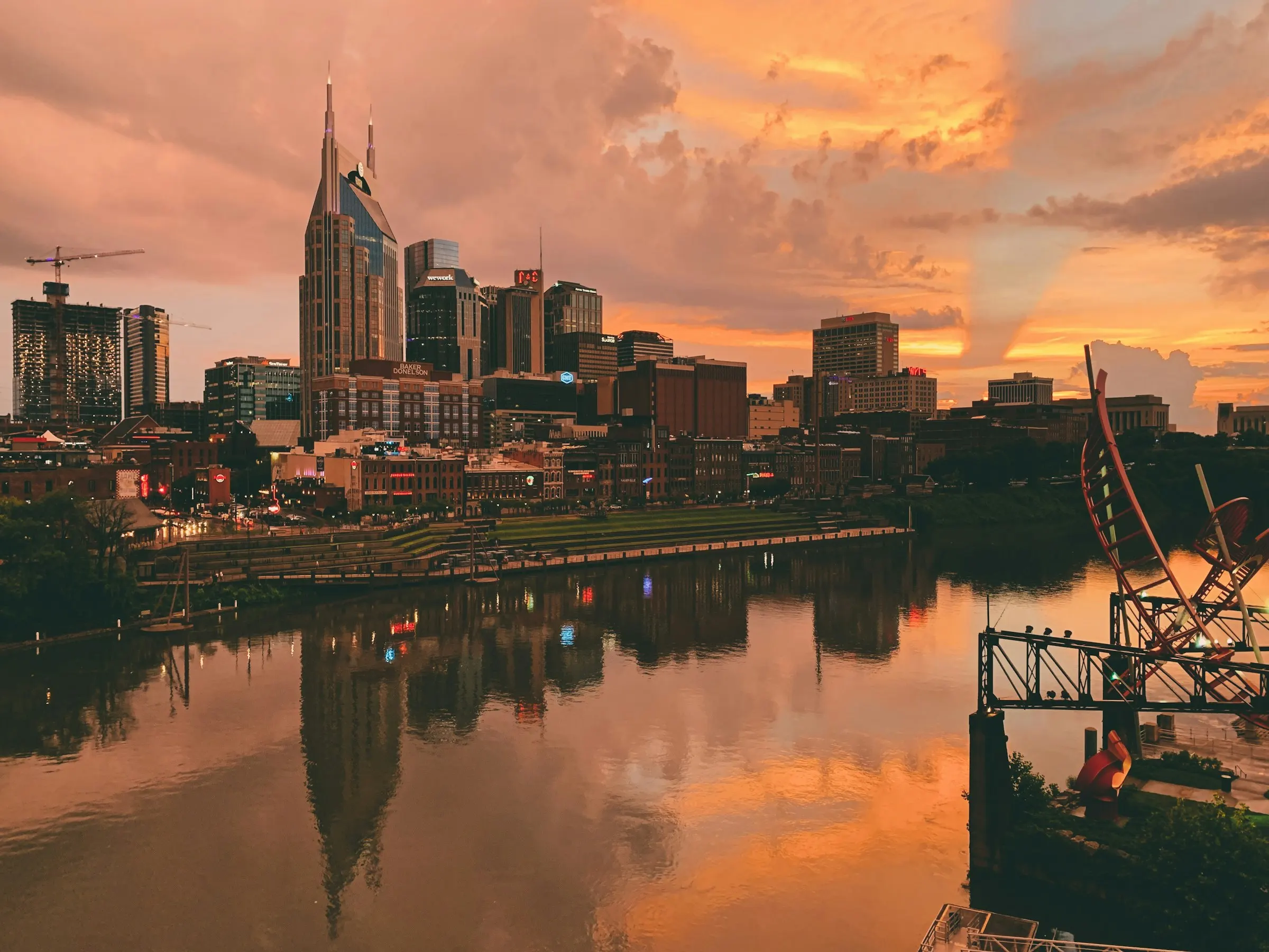 Nashville, Tennessee downtown skyline along the Cumberland River at twilight