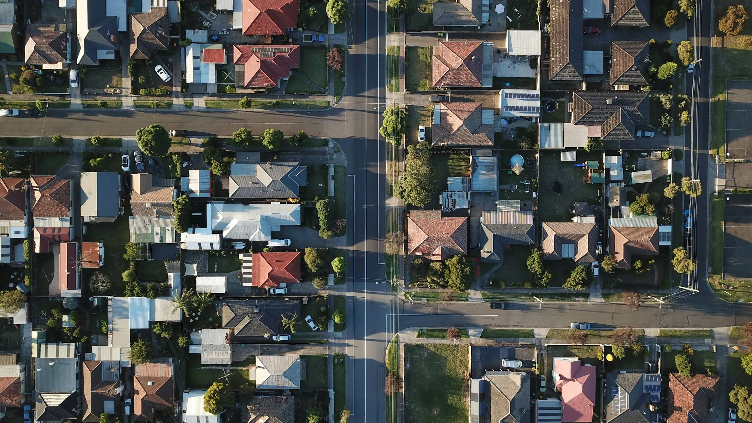 Aerial drone view of an American residential neighbourhood of single-family homes for real estate investment